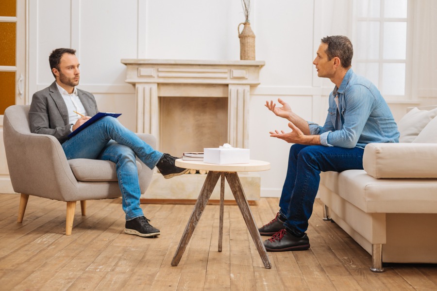 Man doing DBT exercise in therapist's office