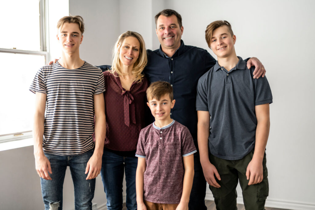 family of five smiling