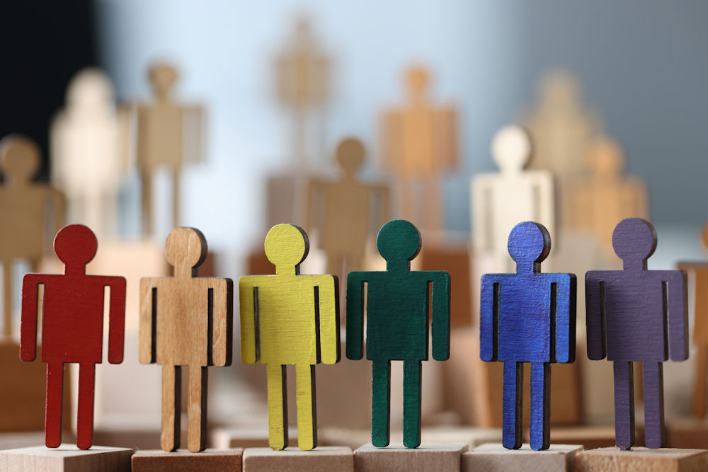 wooden figures of people in various colors representing the different roles of an addicted family