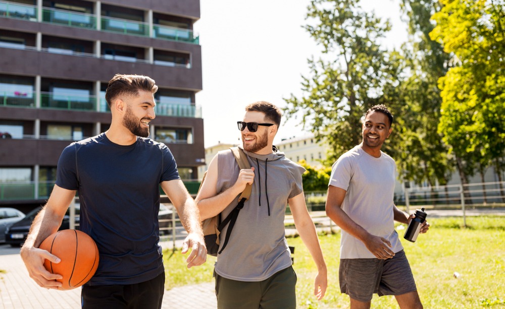 rehab-packing-essentials-guide men talking while heading to basketball court