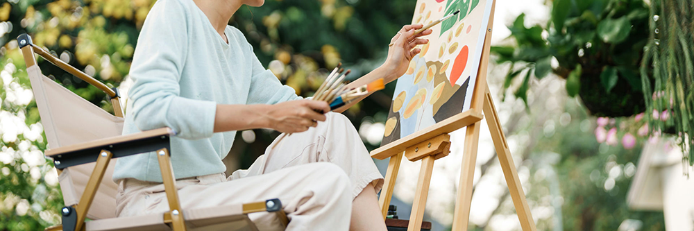 Individual expressing emotions through art and music therapy as part of holistic addiction treatment.