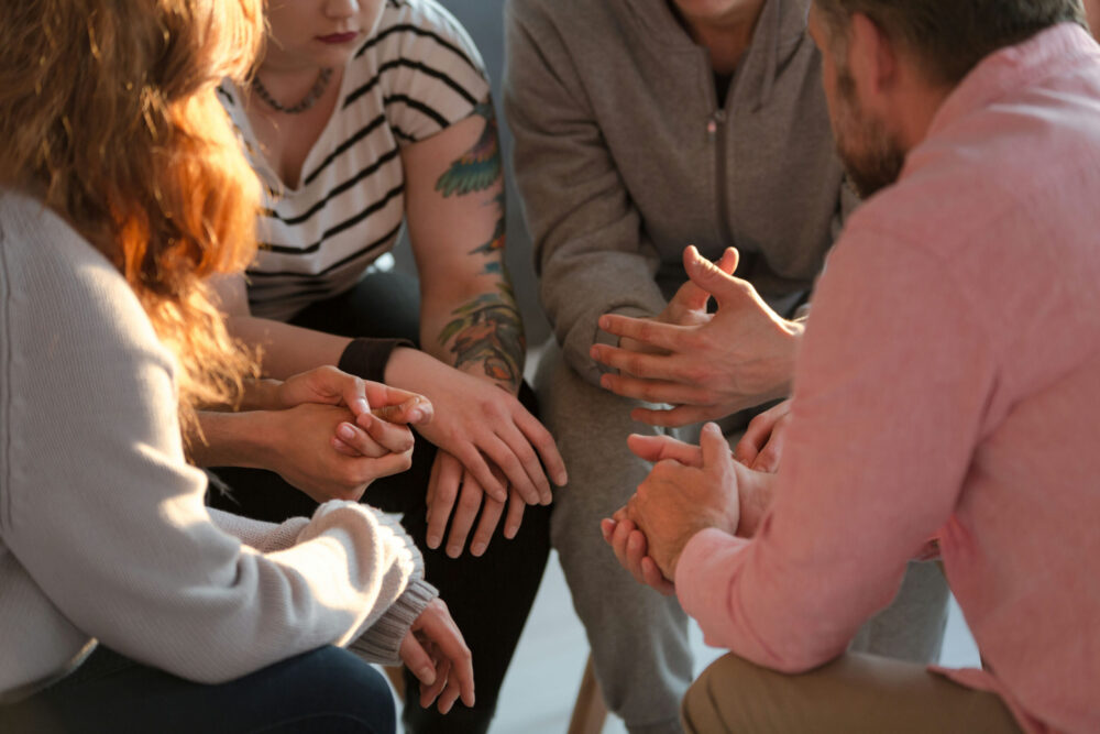 Supportive treatment environment where individuals rebuild connections during addiction recovery.