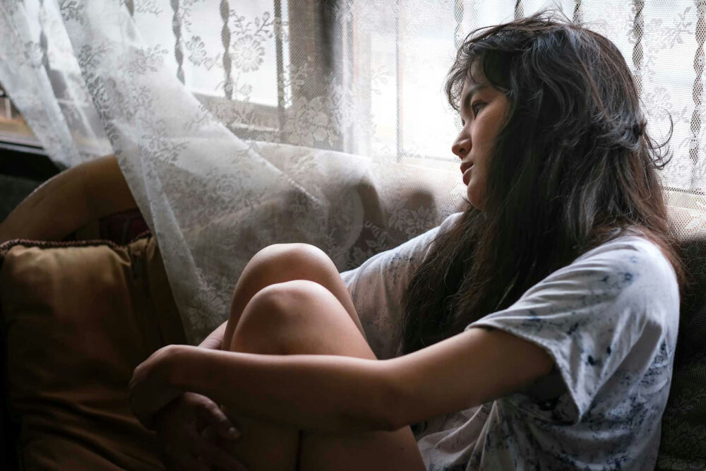 Person resting with low energy representing medication side effects