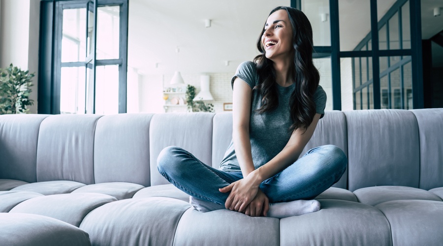 Woman laughing while undergoing individual therapy covered by QualCare.